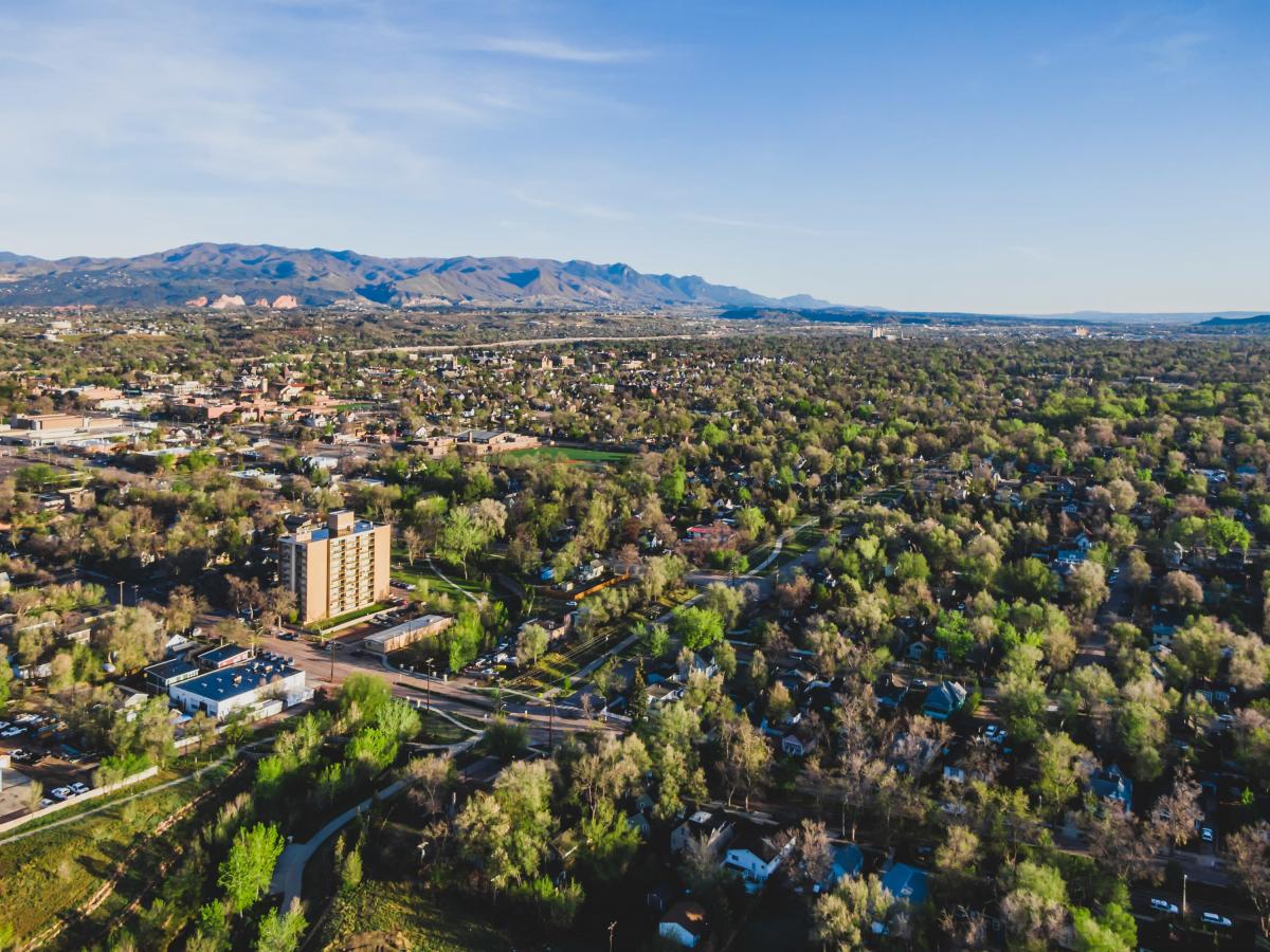 Aerial view of Colorado Springs looking northwest showing a portion of the city’s urban forest from May 2020 (credit: City of Colorado Springs).