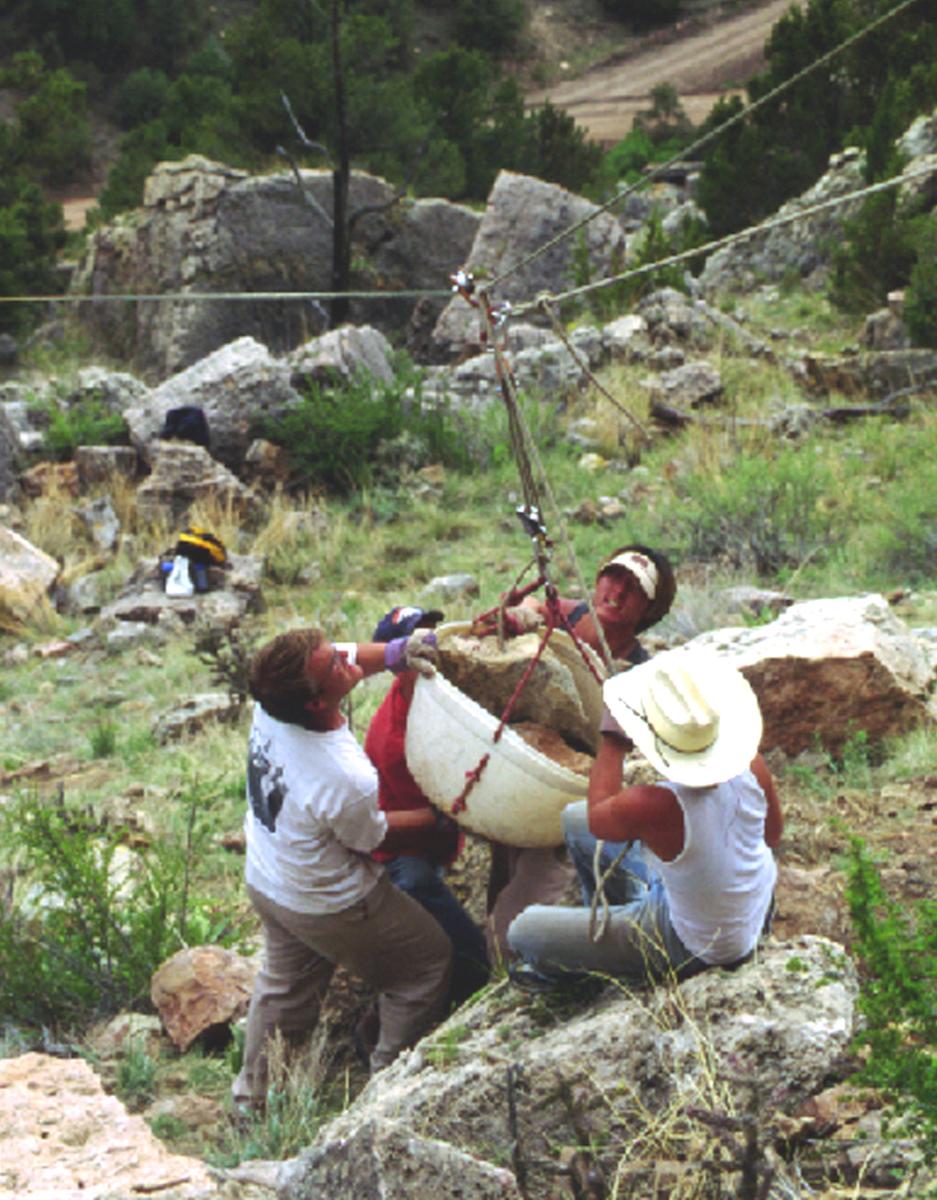 RMFI and volunteers move rock together at Shelf Road, 2000. 